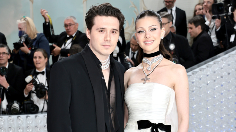 Brooklyn Beckham smiling with Nicola Peltz