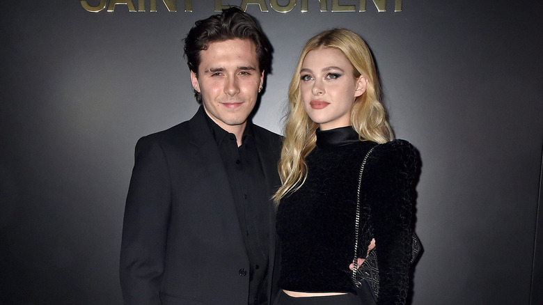 Brooklyn Beckham, posing with Nicola Peltz