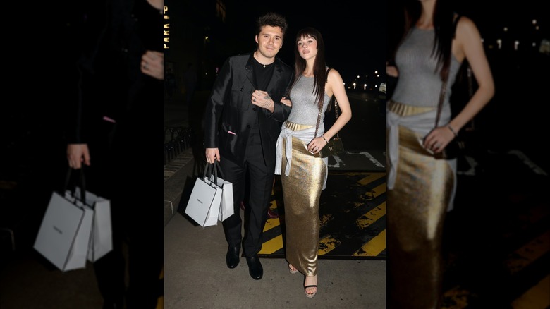 Brooklyn Beckham and Nicola Peltz locking arms in the street in September 2022