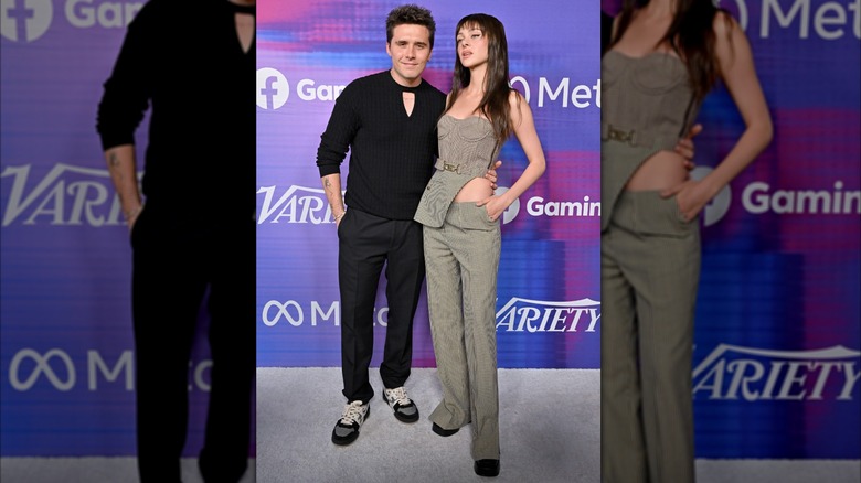 Brooklyn Peltz Beckham posing with his arm around Nicola Peltz Beckham's waist at Variety's 2022 Power of Young Hollywood celebration in 2022