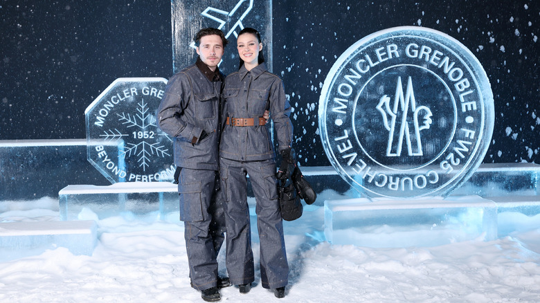 Brooklyn Peltz Beckham and Nicola Peltz posing in snow at the Moncler Grenoble Fall/Winter 2025 Show