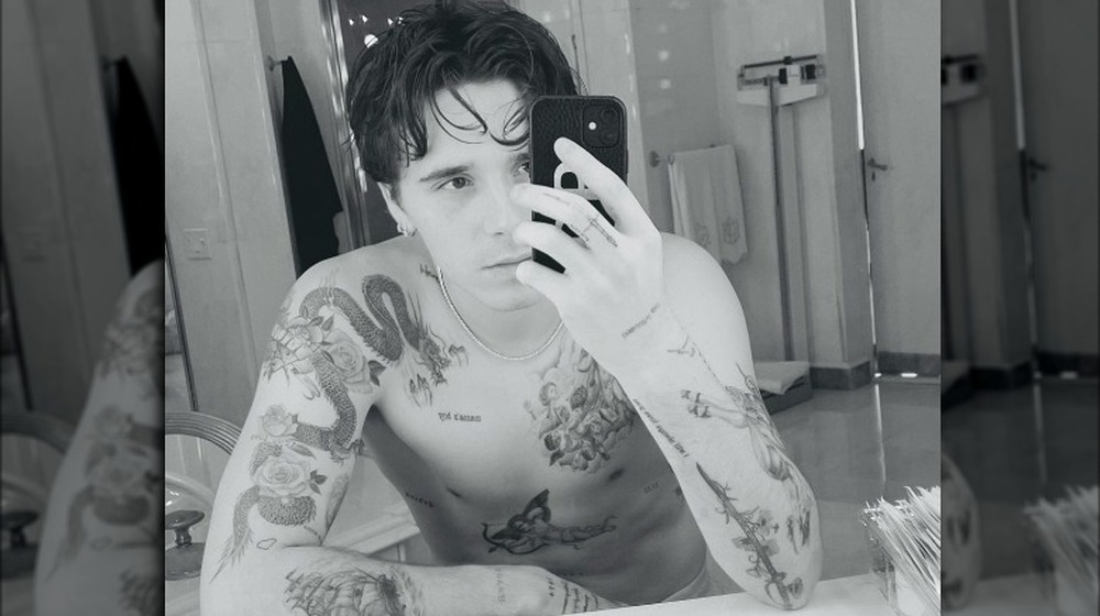 Brooklyn Beckham mirror selfie with tattoos