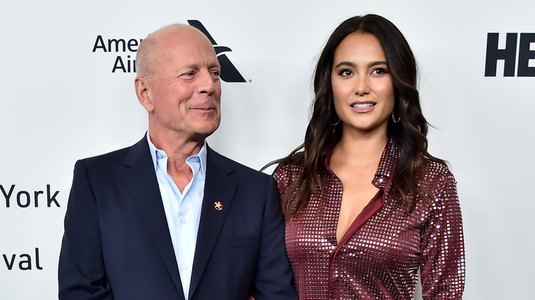 Bruce Willis and Emma Heming Willis pose 