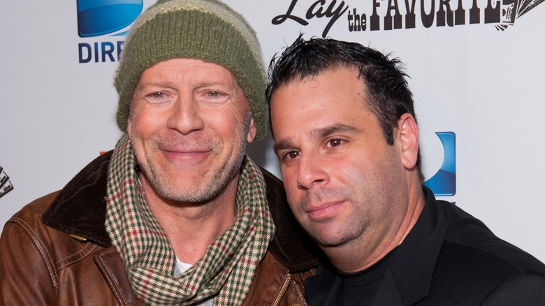 Bruce willis smiling with randall emmett