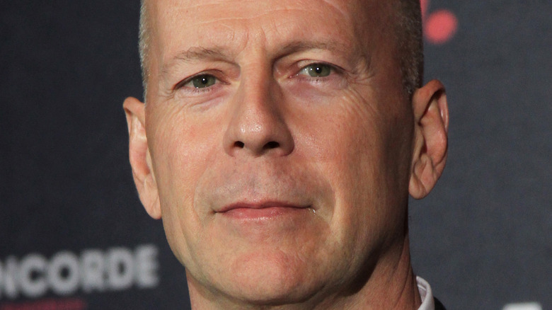 Bruce Willis poses at an event.