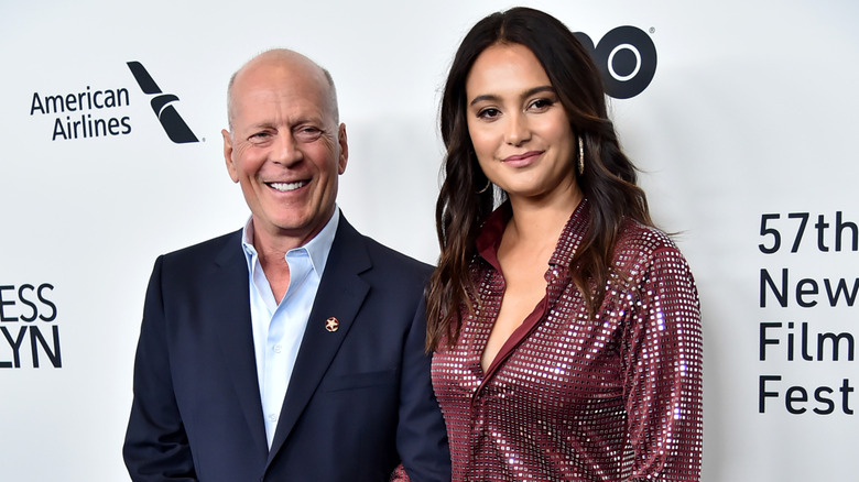Bruce and Emma Willis posing