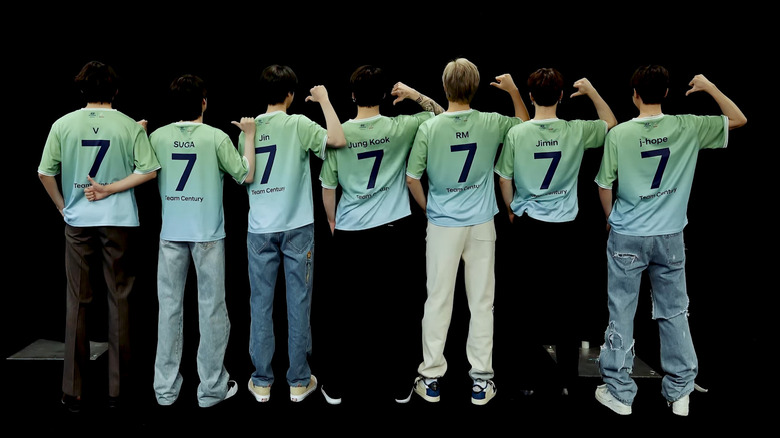 BTS wearing soccer jerseys with the number 7 on it