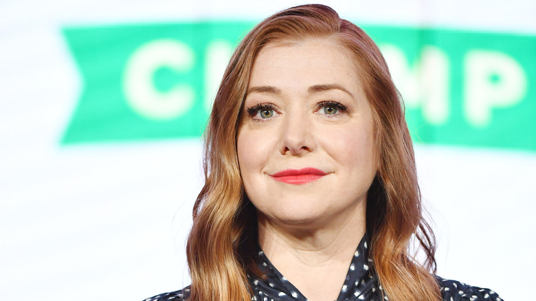 Alyson Hannigan photographed in front of a white background