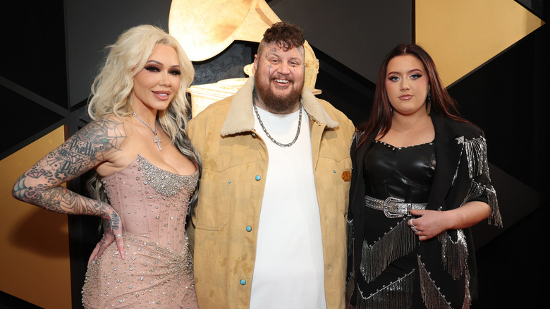 Bunnie Xo, Jelly Roll, and Bailee Ann posing at the Grammy Awards.