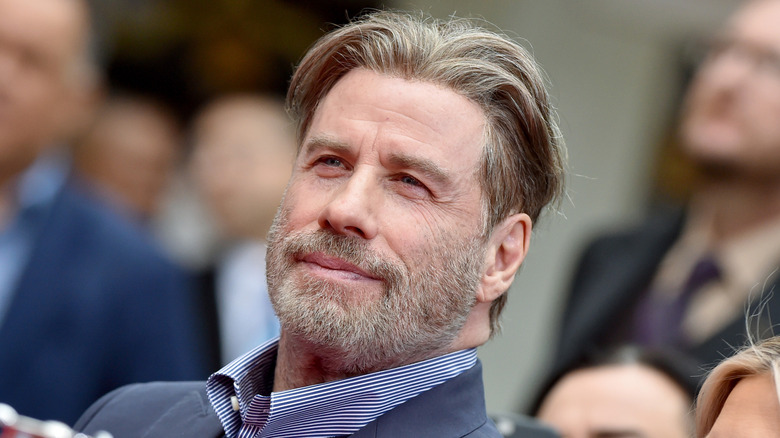 John Travolta pictured with sandy blond hair.