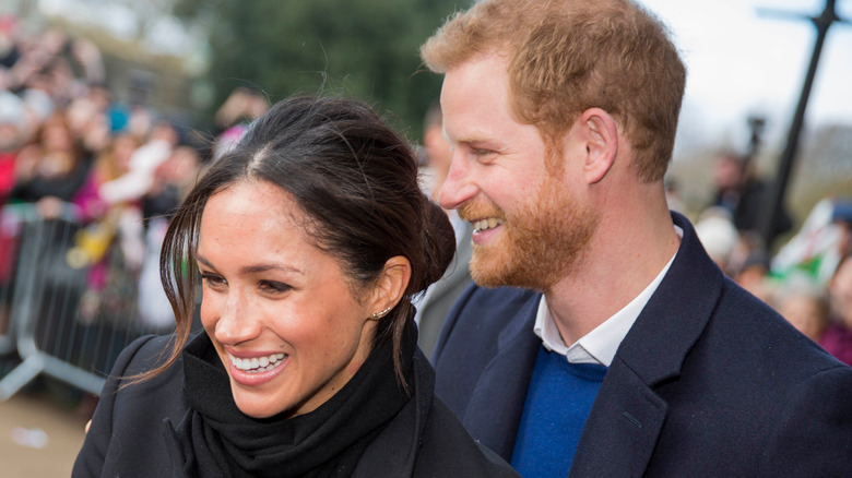Prince Harry and Meghan Markle smiling
