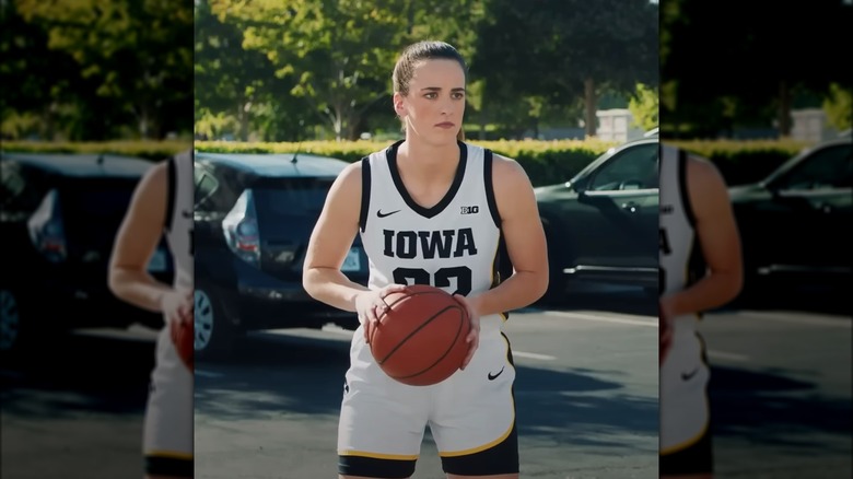 Caitlin Clark holding basketball