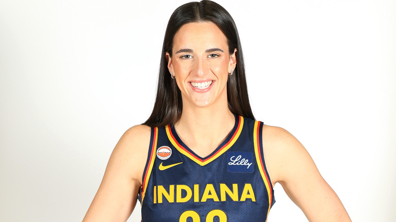 Caitlin Clark posing at the Indiana Fever media day in April 2026.