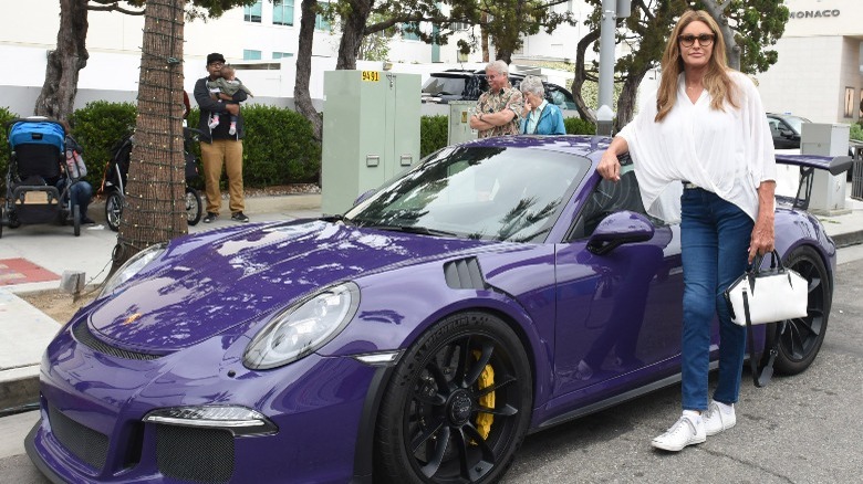 Caitlyn Jenner poses with a car