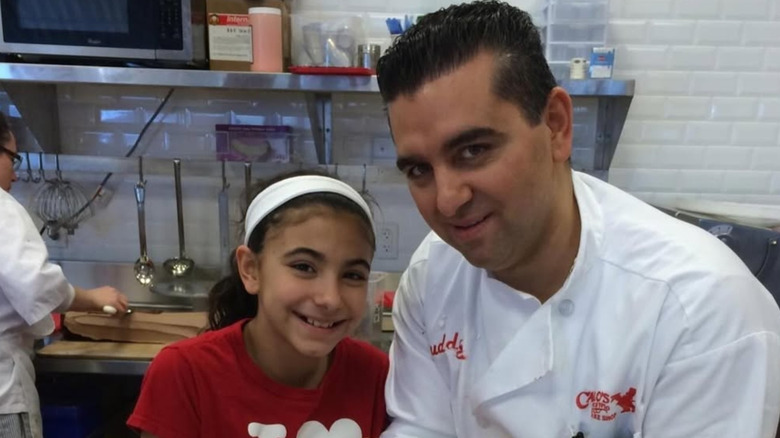 Buddy Valastro and Sofia Valastro posing.