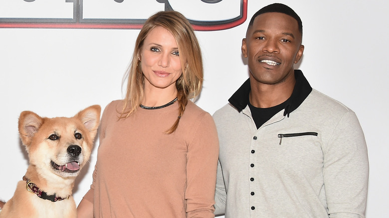 Cameron Diaz and Jamie Foxx with a dog