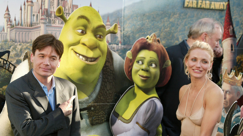 Mike Myers and Cameron Diaz posing with an image of their "Shrek" characters
