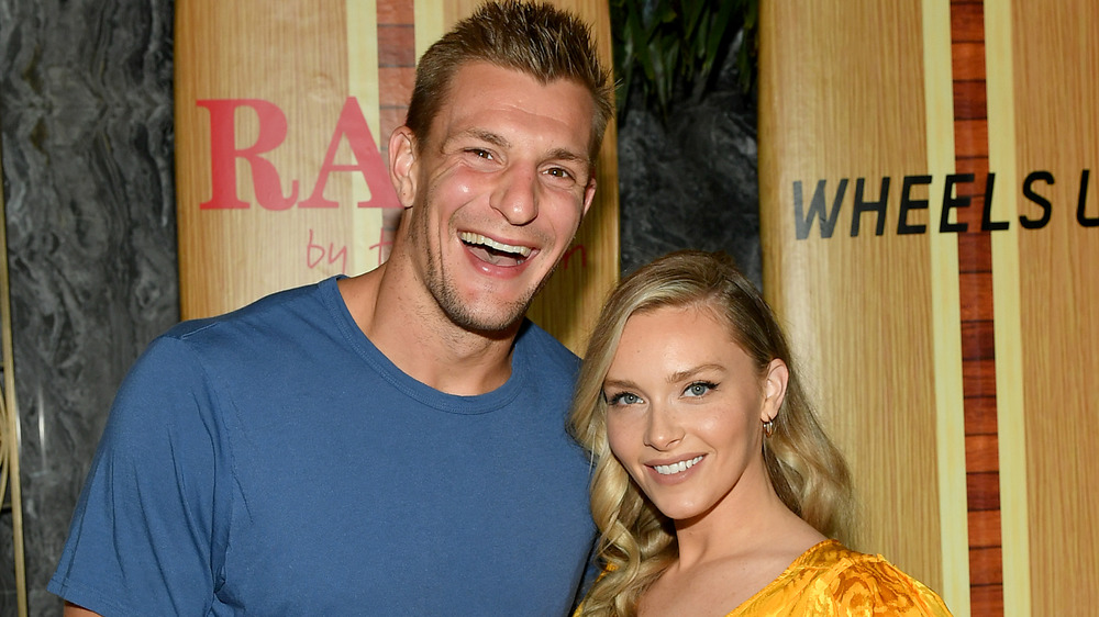 Camille Kostek and Rob Gronkowski posing