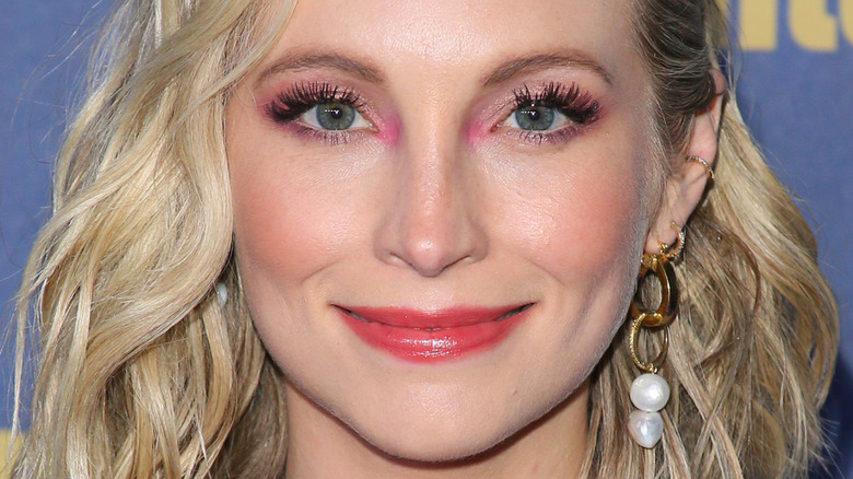 Candice Accola poses in pink eye makeup