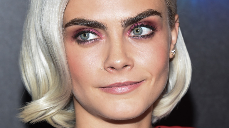 Cara Delevingne smiling slightly