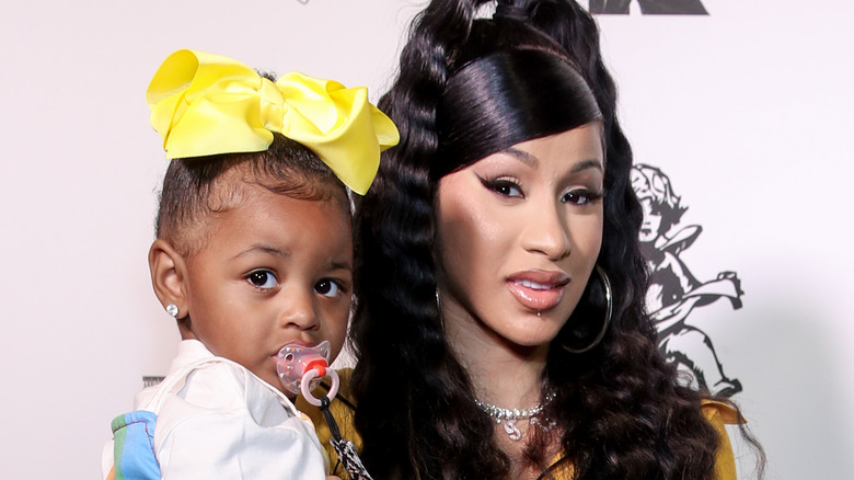 Cardi B holding her daughter