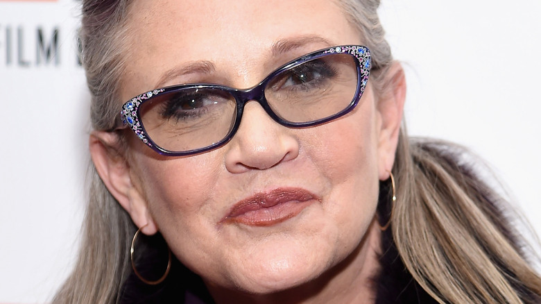 Carrie Fisher smiles on red carpet