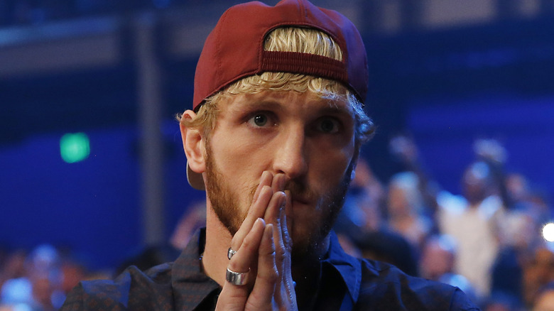 Logan Paul with hands clasped in prayer