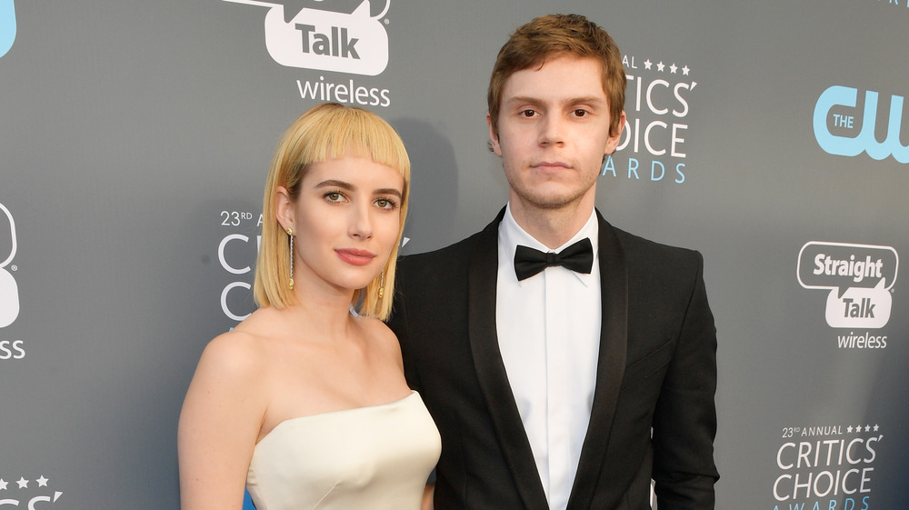 Emma Roberts and Evan Peters looking glum 