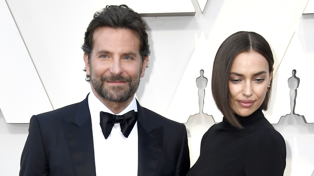 Bradley Cooper and Irina Shayk looking irritated 