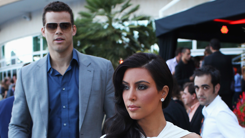 Kris Humpries trailing behind Kim Kardashian 