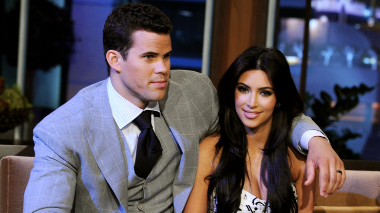 Kris Humphries with arm around Kim Kardashian