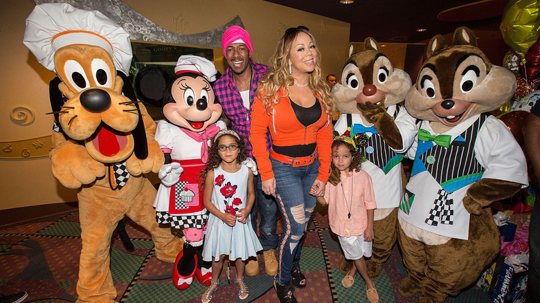 Nick Cannon, Mariah Carey, and twins with Disney characters