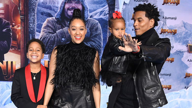 Tia Mowry, Cory Hardrict posing with kids
