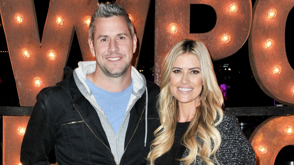 Ant Anstead and Christina Anstead, posing arm-in-arm and smiling