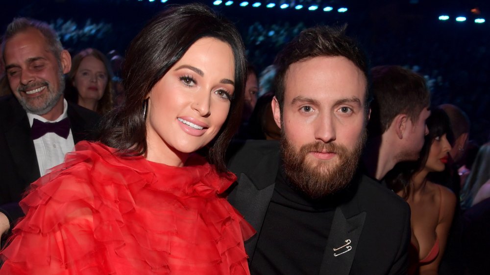Kacey Musgraves and Ruston Kelly sitting at an awards show together