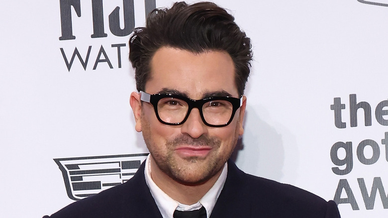 Dan Levy smiling