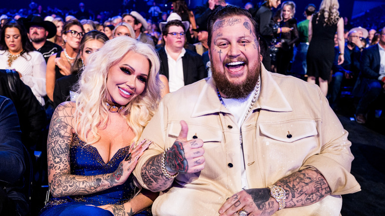 Jelly Roll and Bunnie Xo sitting at an award show