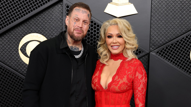 Jelly Roll and Bunnie XO pose on Grammys red carpet