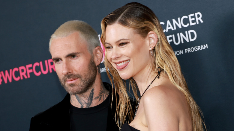 Adam Levine and Behati Prinsloo posing