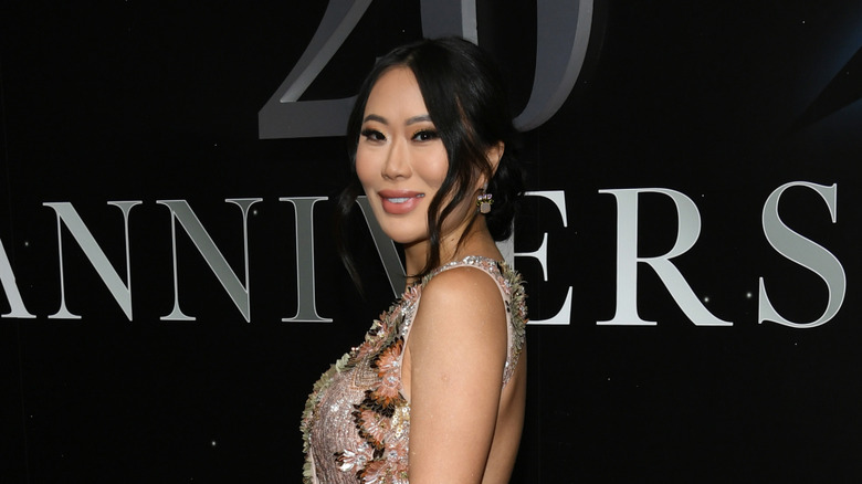 Kelly Mi Li showing off baby bump