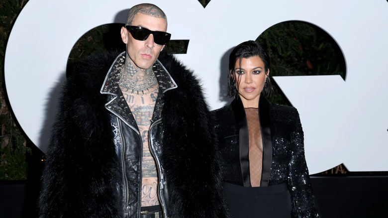 Kourtney Kardashian, posing with Travis Barker