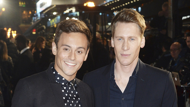 Tom Daley, Dustin Lance Black both posing