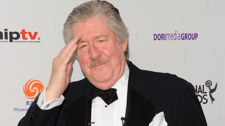 Edward Herrmann saluting