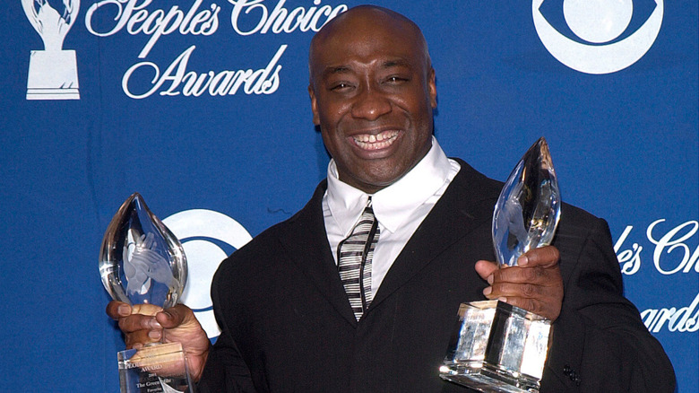 Michael Clarke Duncan holding two awards