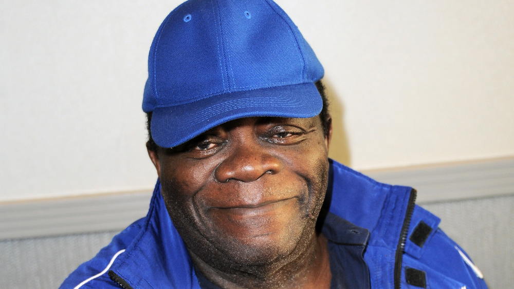 Yaphet Kotto smiling for photo