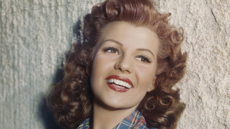 Actress Rita Hayworth poses for a photo smiling circa 1950