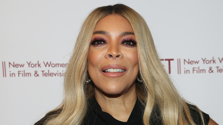 Media personality Wendy Williams smiling and staring ahead on the red carpet in 2019