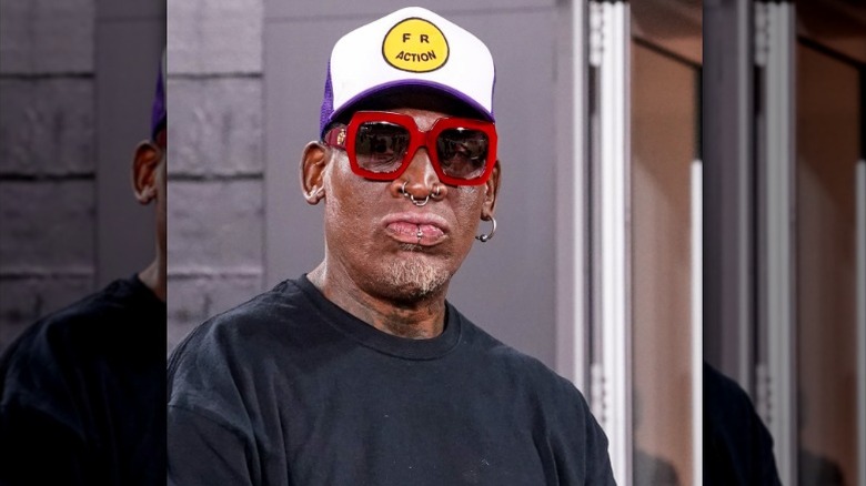 Dennis Rodman in hat and glasses