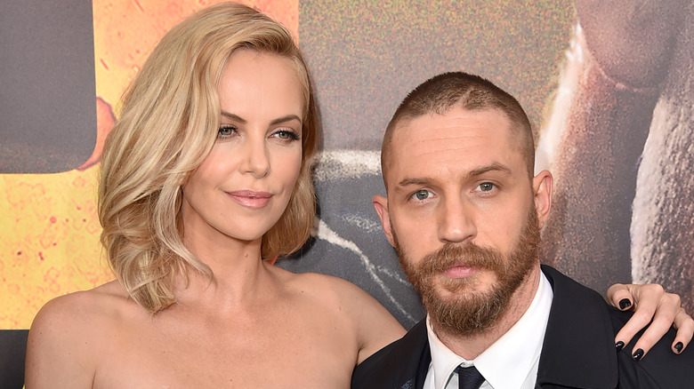 Charlize Theron and Tom Hardy on a red carpet