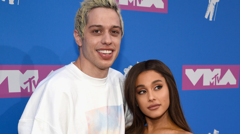 Pete Davidson with Ariana Grande posing